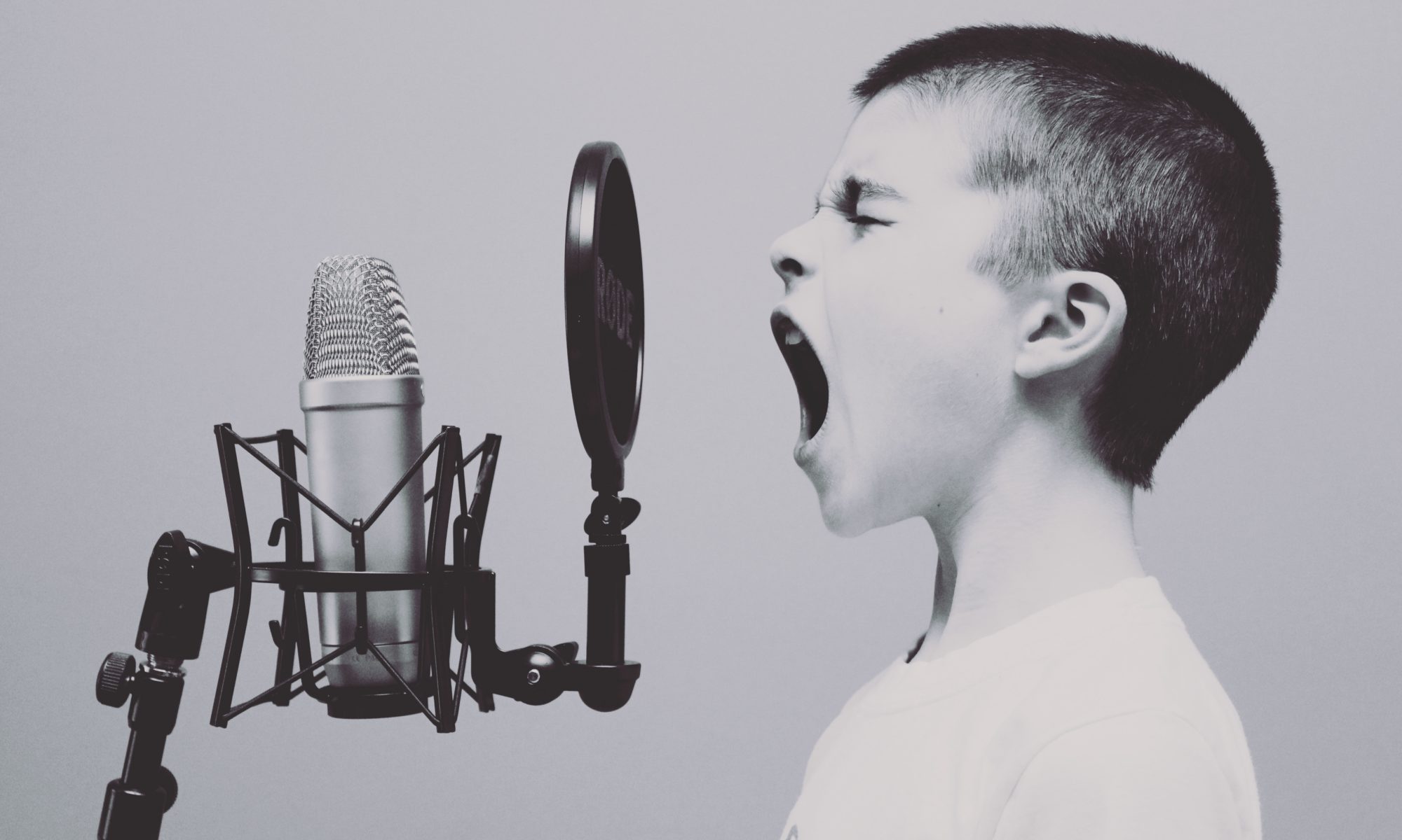 child screaming into recording microphone