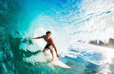 Photo of surfer getting barelled